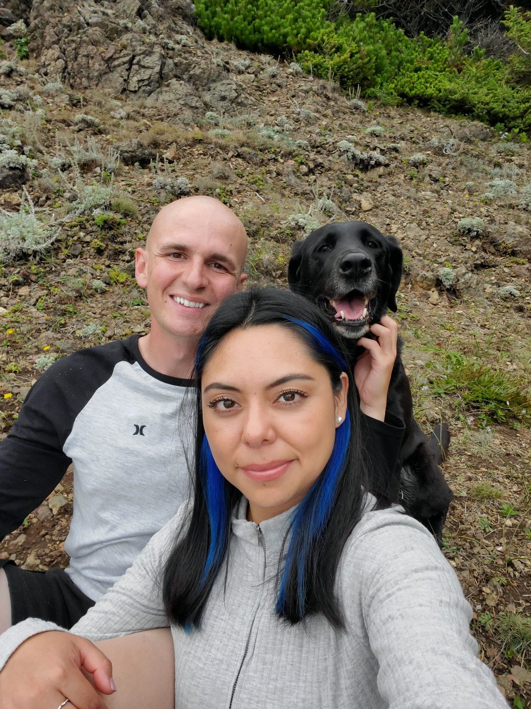 Dan and Magy Smith with Luna on a coastal hillside